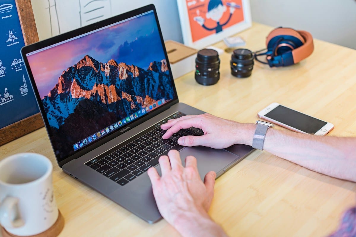 A MacBook with code on the screen.
